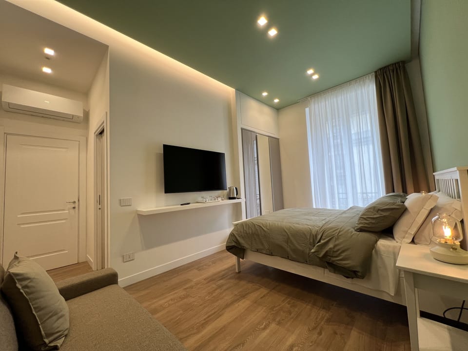 Deluxe Triple Room, Non Smoking, City View | Premium bedding, down comforters, pillowtop beds, in-room safe