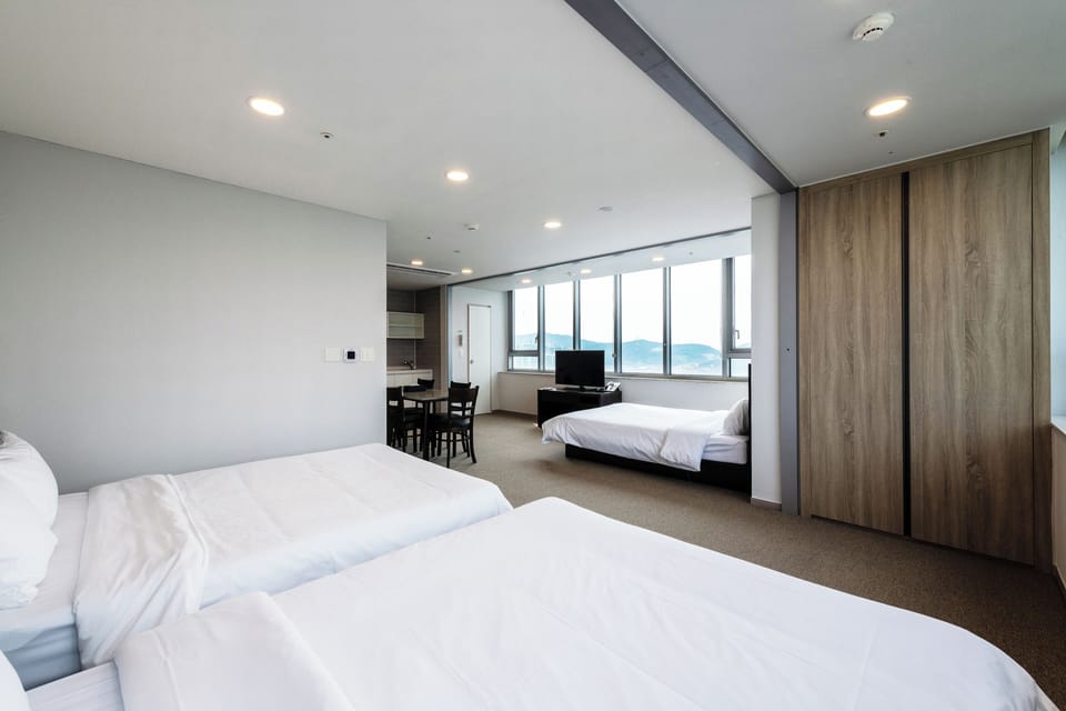 Family Triple Room | Down comforters, blackout drapes, free WiFi, bed sheets