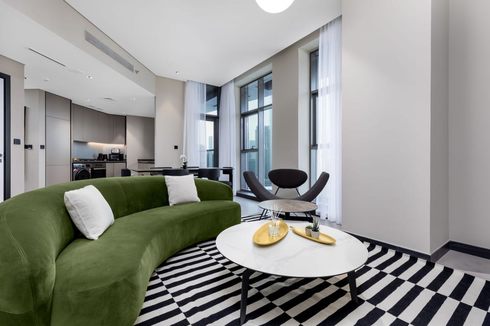 Deluxe Apartment | Living area | 65-inch Smart TV with cable channels