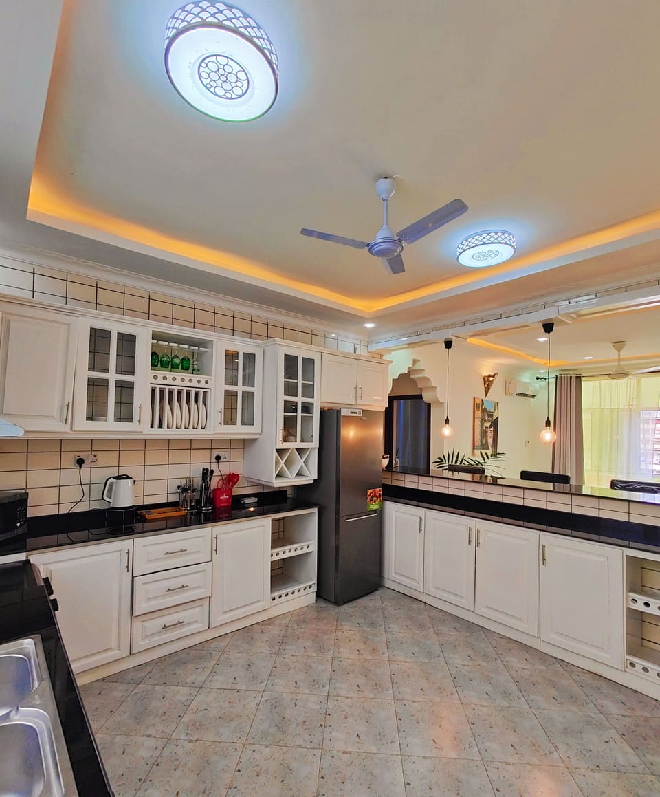 Design Apartment | Private kitchen | Full-size fridge, microwave, oven, stovetop