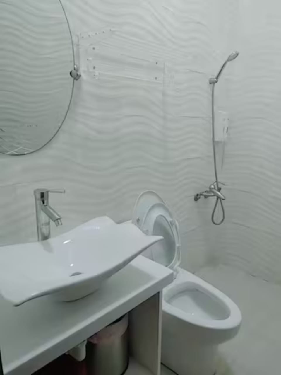 Shower, hair dryer, slippers, towels
