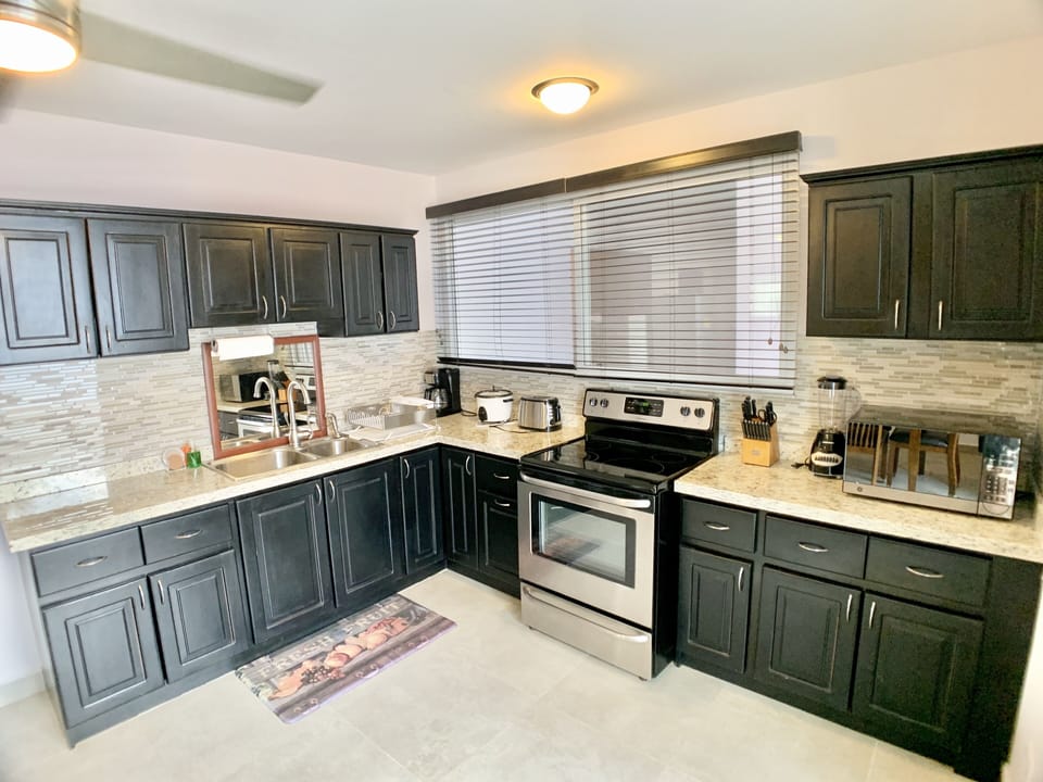 Condo, 5 Bedrooms | Private kitchen | Coffee/tea maker, toaster
