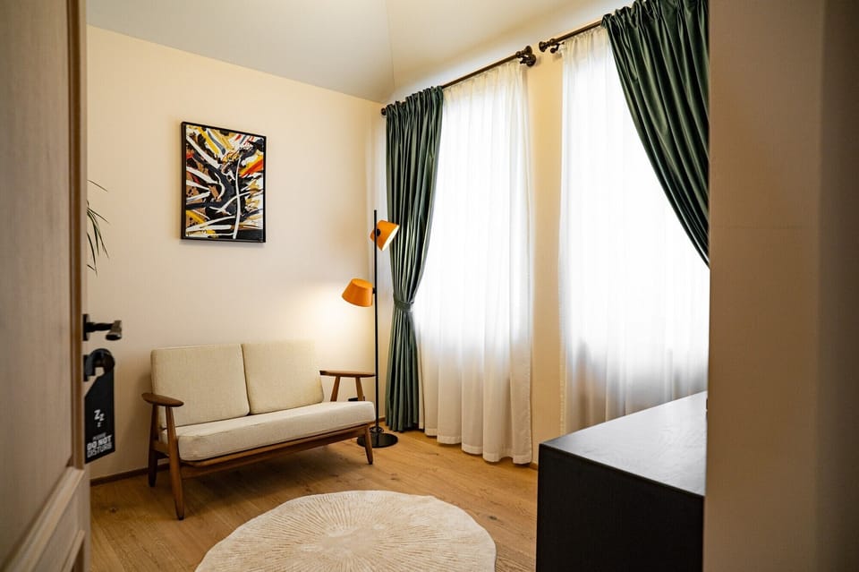 Junior Double Room | Living area | 27-cm TV with satellite channels