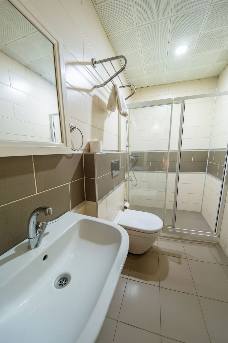 Deluxe Room | Bathroom | Designer toiletries, hair dryer, slippers, towels