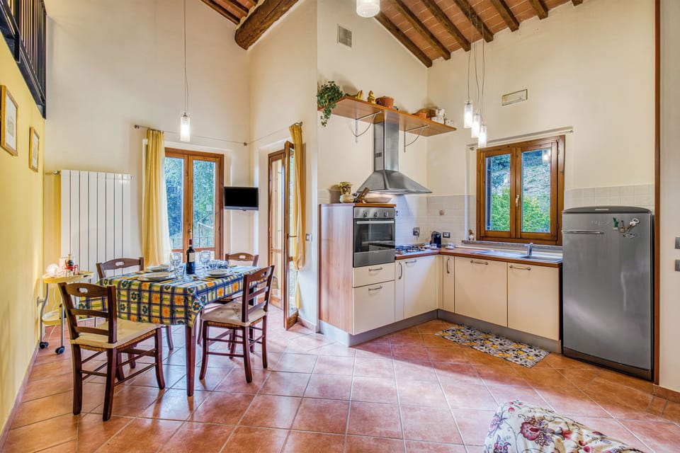 Standard Apartment, 2 Bedrooms, Air conditioning, Mountainside (Tuscan Sun Duplex with Balcony and) | Private kitchen | Coffee/tea maker, dining table