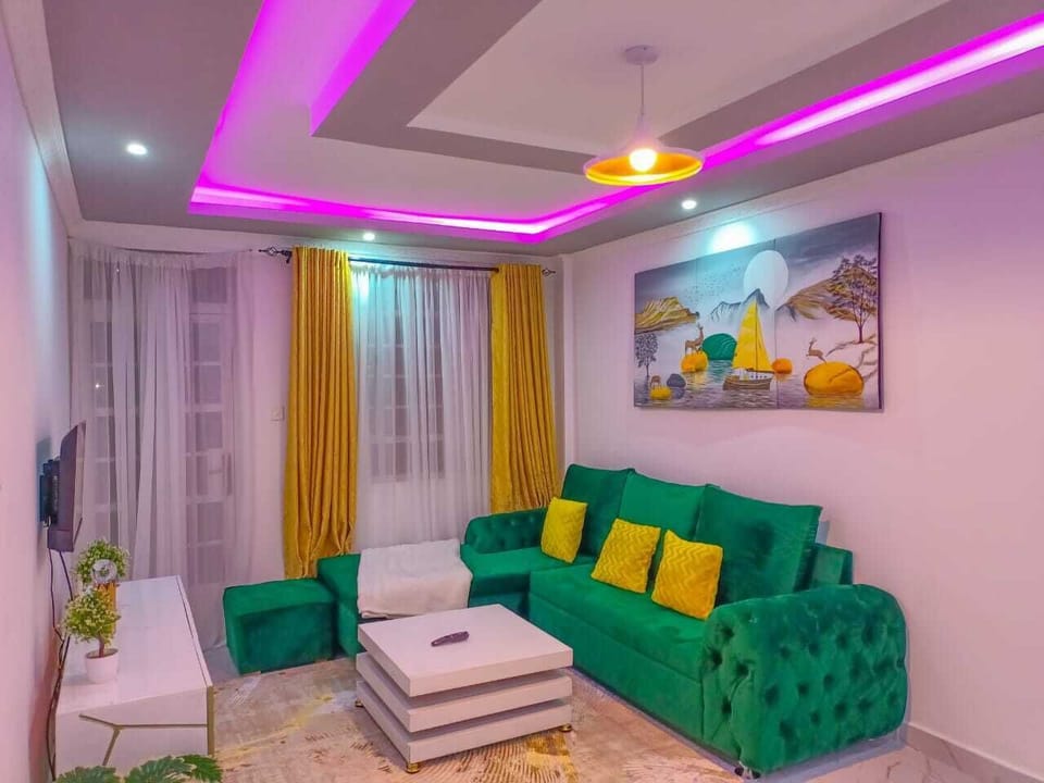Business Apartment | Living area | 24-inch Smart TV with digital channels