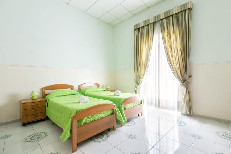 Double Room, Sea View | Down comforters, in-room safe, desk, blackout drapes