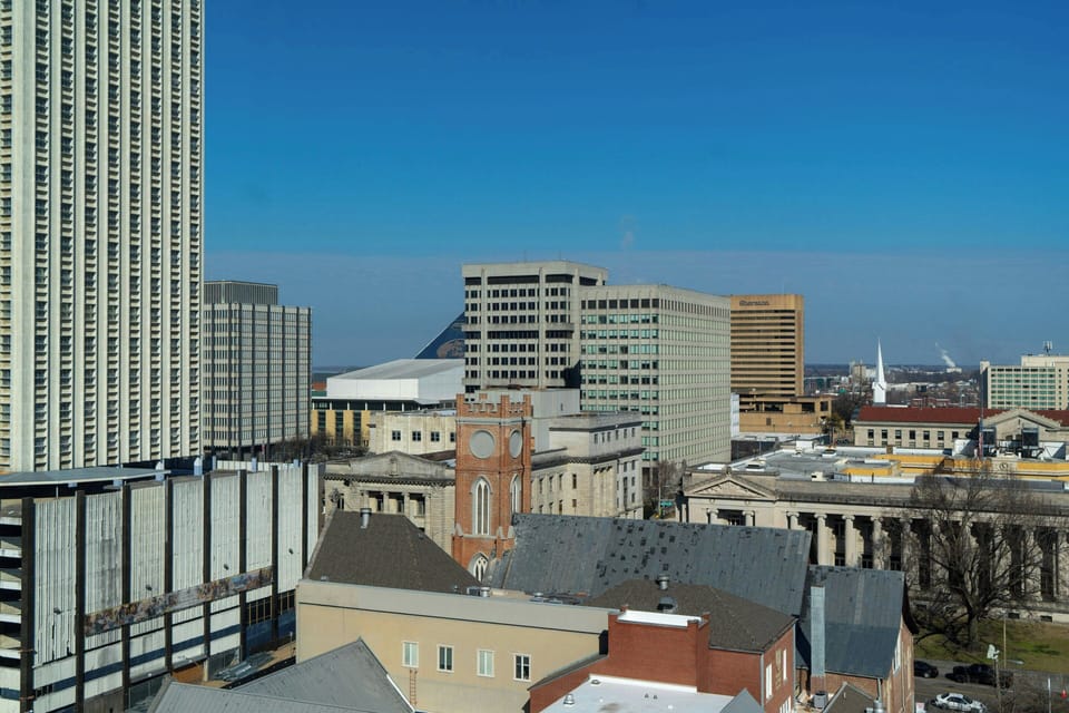 Premium bedding, pillowtop beds, laptop workspace, blackout drapes