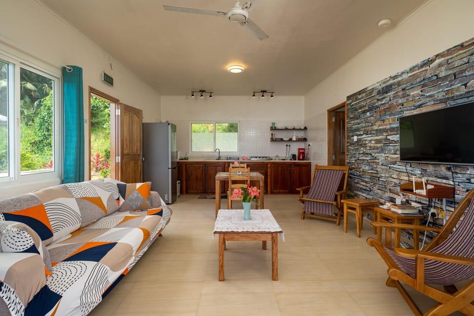 Standard Apartment, Garden View | Living area | 32-inch flat-screen TV with cable channels, TV