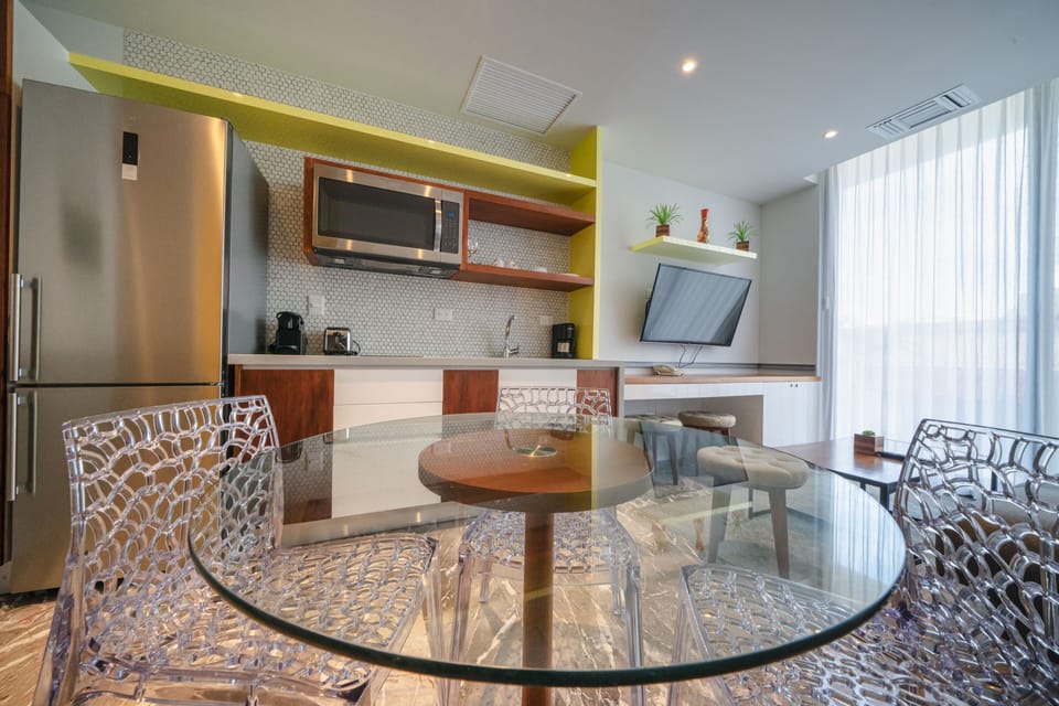 Deluxe Condo | Private kitchen | Full-size fridge, microwave, toaster, blender
