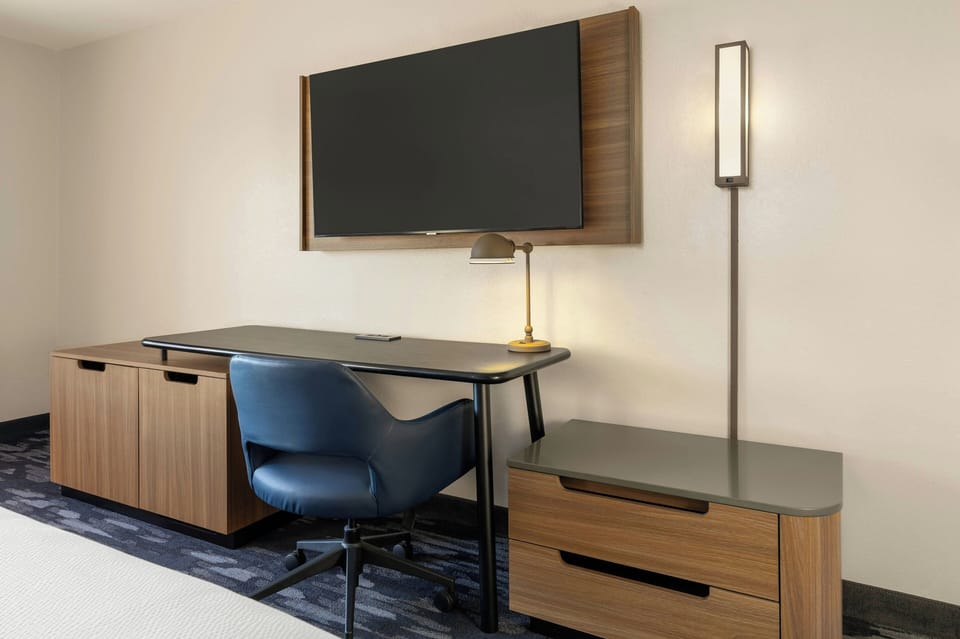 Pillowtop beds, desk, blackout drapes, iron/ironing board