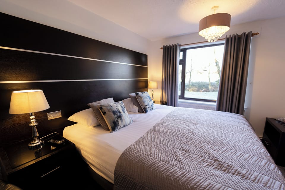 Premium bedding, Tempur-Pedic beds, desk, laptop workspace
