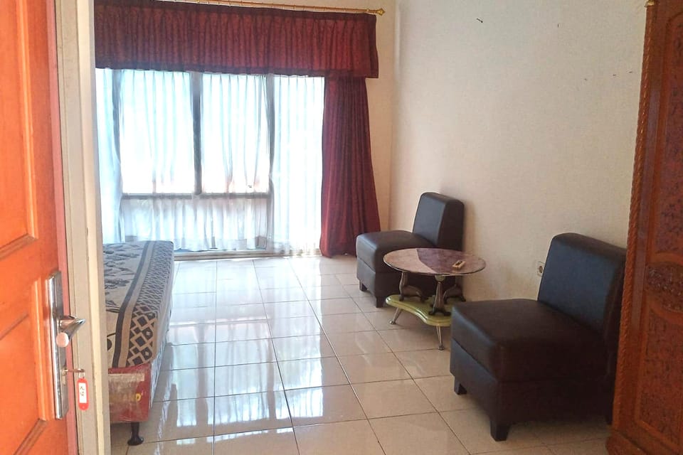Family Room | Desk, blackout drapes, iron/ironing board, rollaway beds
