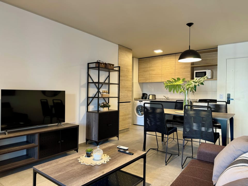 Standard Apartment | Living area | 32-inch flat-screen TV with cable channels