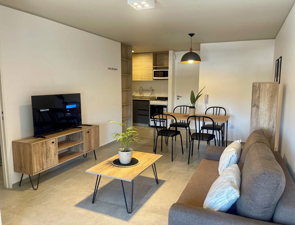 Standard Apartment | Living area | 32-inch flat-screen TV with cable channels