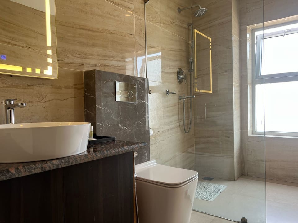 Deluxe Double or Twin Room | Bathroom | Hair dryer, slippers, towels, soap