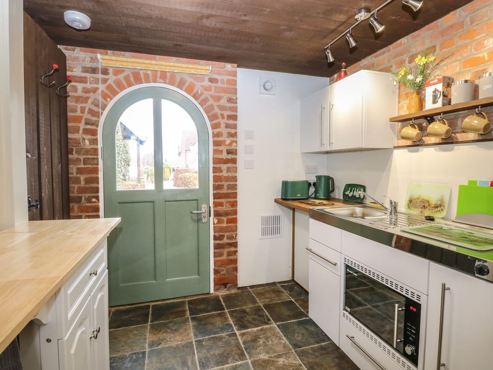 Fridge, electric kettle, toaster, cookware/dishes/utensils
