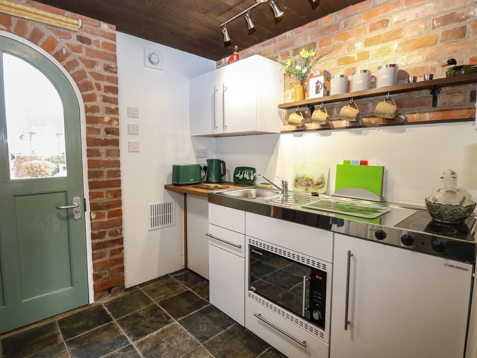 Fridge, electric kettle, toaster, cookware/dishes/utensils