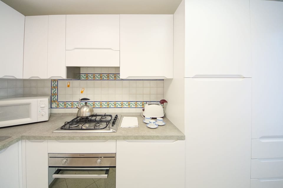 Apartment | Private kitchen | Full-size fridge, microwave, oven, stovetop