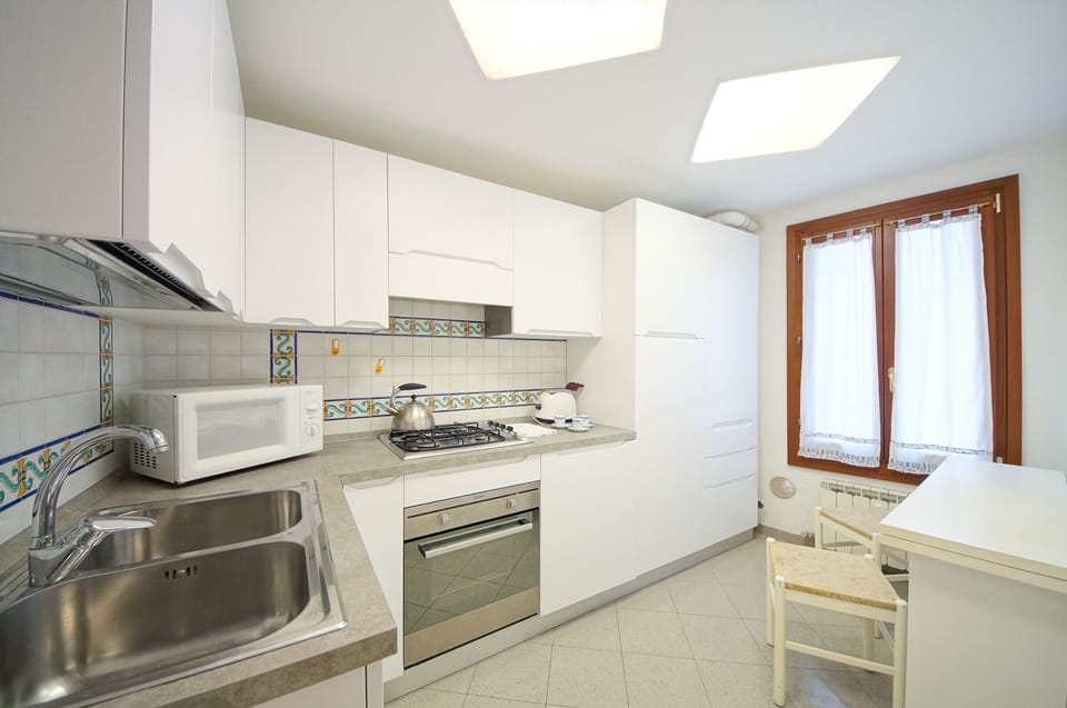 Apartment | Private kitchen | Full-size fridge, microwave, oven, stovetop