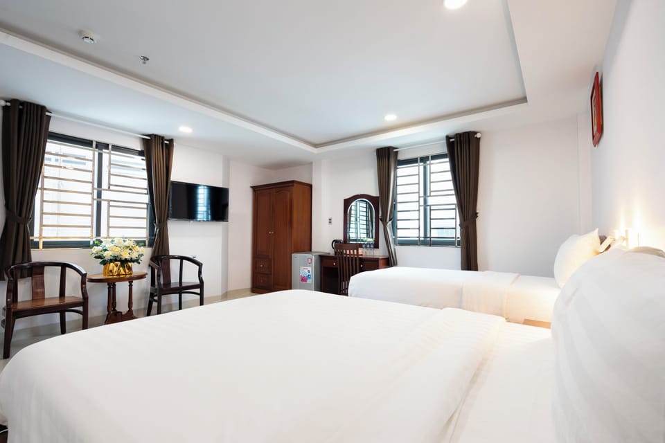 Superior Triple Room, Multiple Beds | Living area | 50-inch Smart TV with cable channels