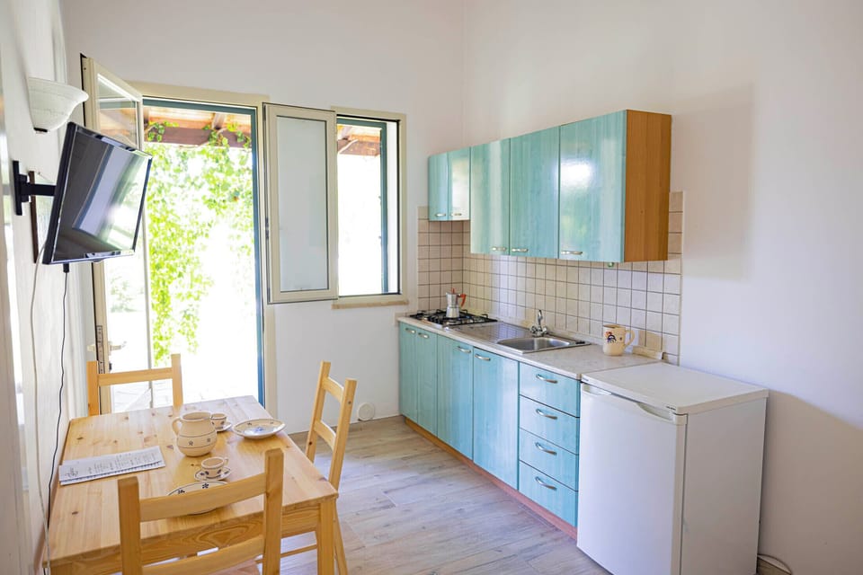 Royal Quadruple Room | Private kitchen | Dining tables