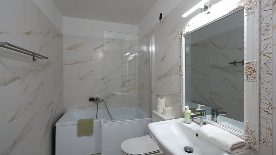 Superior 4-bed room | Bathroom | Shower, hair dryer, towels, soap