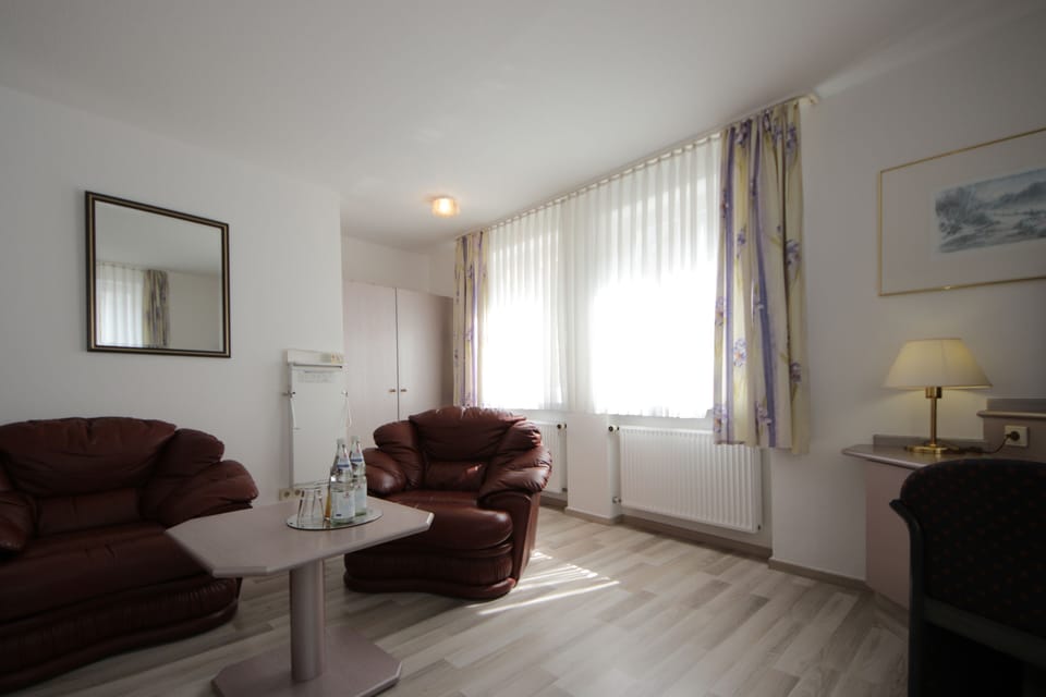 Triple Room | Living area | Flat-screen TV