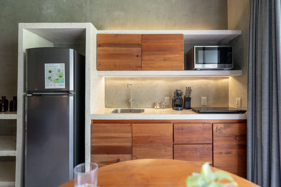 Deluxe Studio | Private kitchen | Full-size fridge, microwave, cookware/dishes/utensils