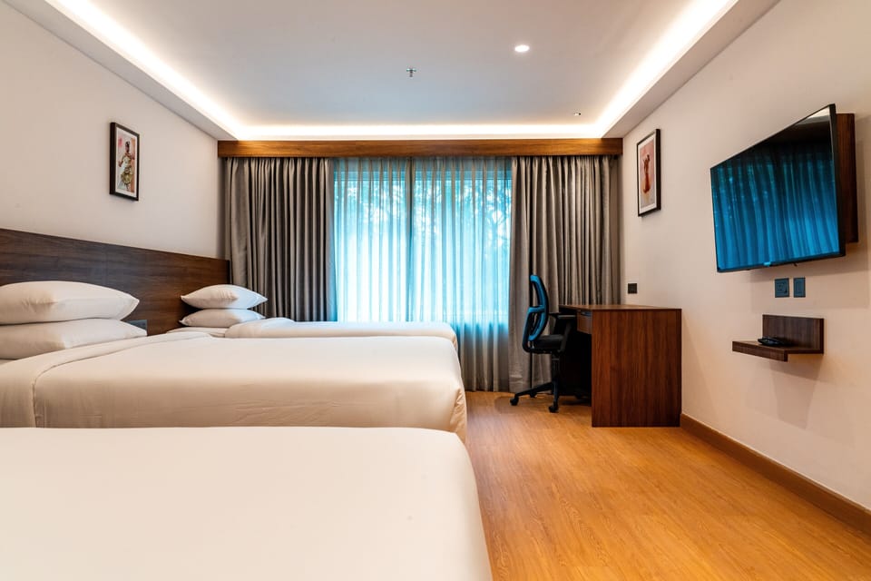 Family Triple Room | Desk, blackout drapes, soundproofing, rollaway beds
