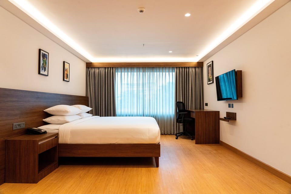 Elite Family Room | Desk, blackout drapes, soundproofing, rollaway beds