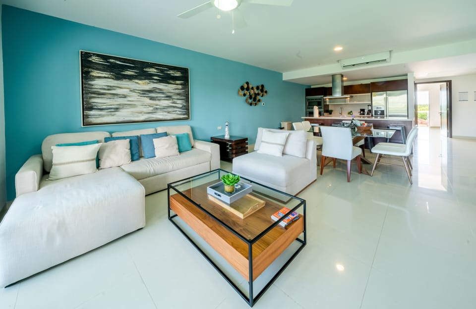 Deluxe Condo | Living area | 50-inch flat-screen TV with digital channels