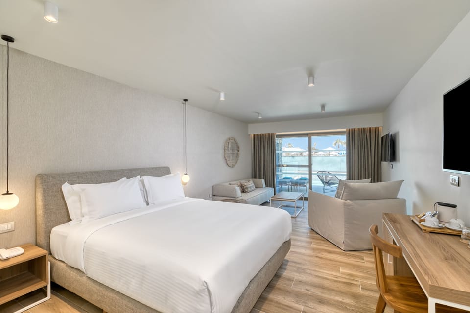 Junior Suite, Private Pool | In-room safe, desk, free WiFi, bed sheets