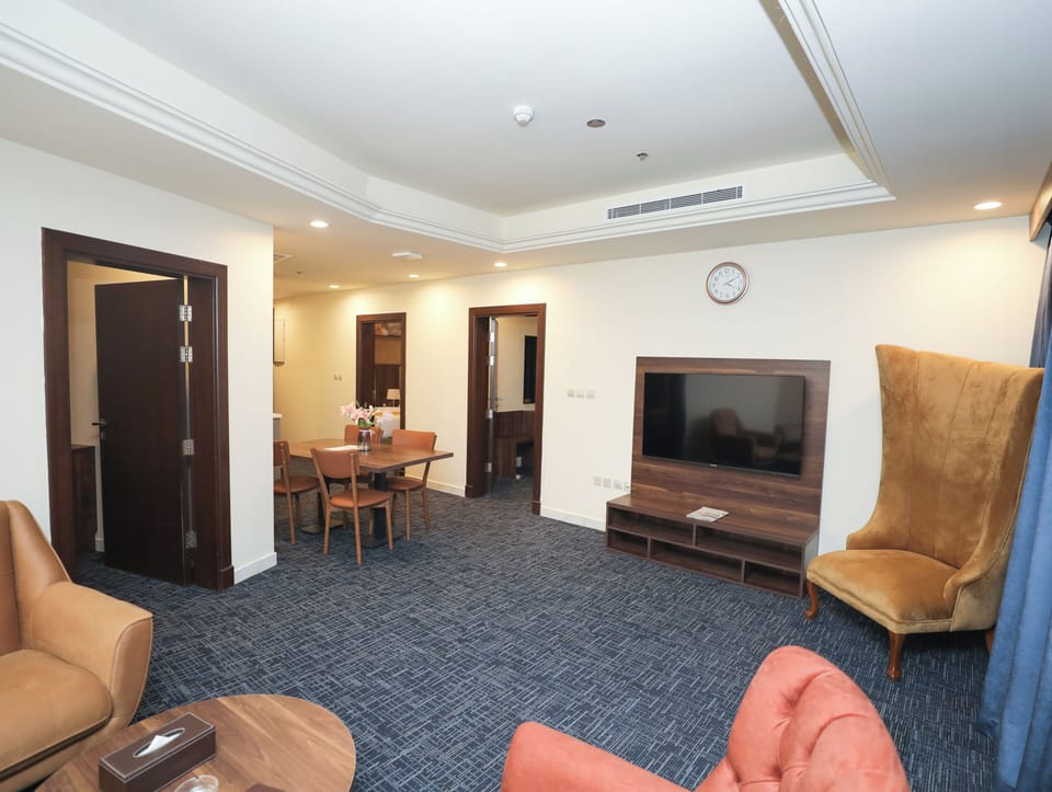 Family Suite | Living room | 55-inch Smart TV with satellite channels
