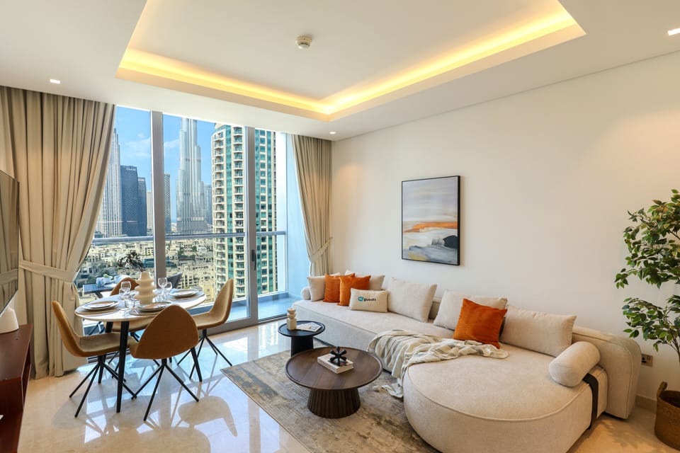 Deluxe Apartment | Living area | 50-inch Smart TV with cable channels