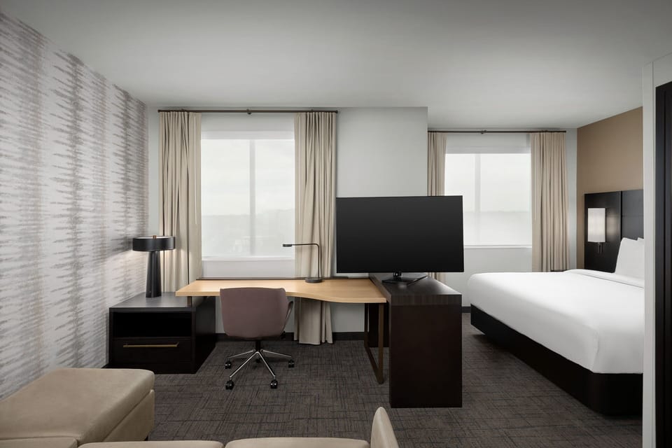 Premium bedding, desk, blackout drapes, iron/ironing board
