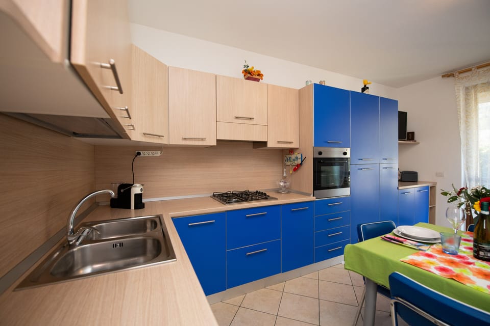 Comfort Apartment | Private kitchen | Full-size fridge, microwave, oven, coffee/tea maker