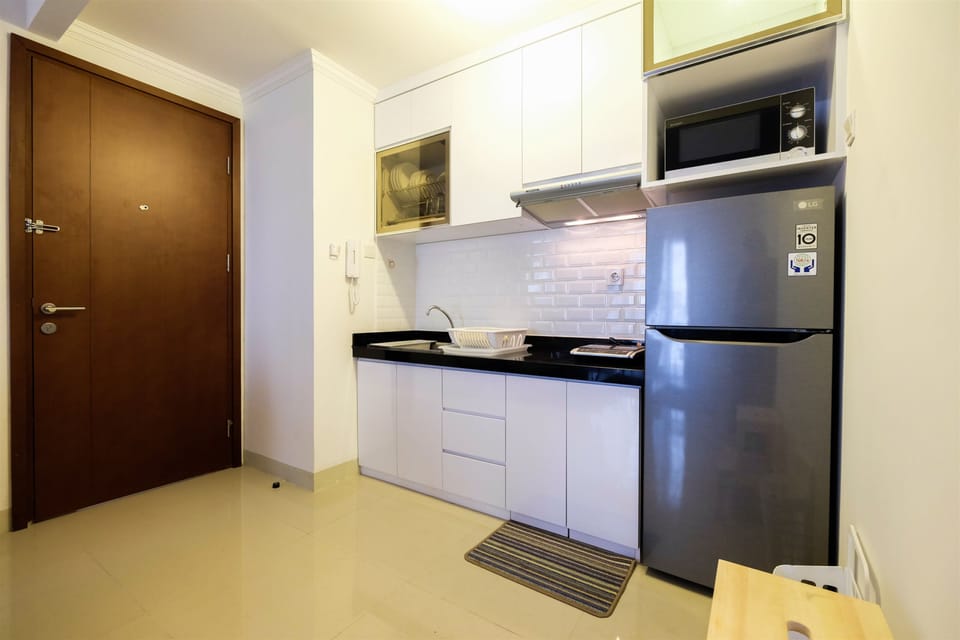 Apartment | Private kitchen | Fridge, microwave, stovetop, dining tables