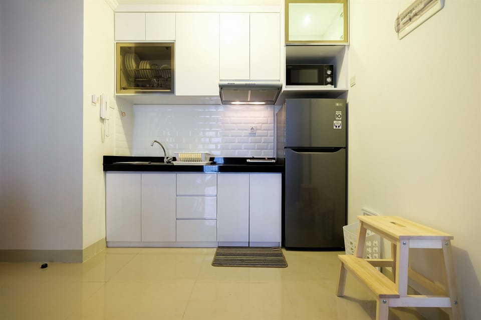 Apartment | Private kitchen | Fridge, microwave, stovetop, dining tables