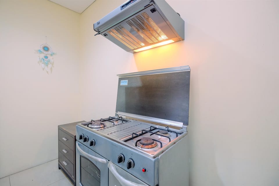 Apartment | Private kitchen | Fridge, stovetop, rice cooker, dining tables