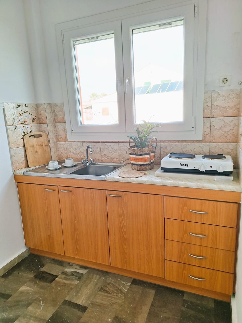 Family Apartment | Private kitchen | Full-size fridge, stovetop, electric kettle, highchair