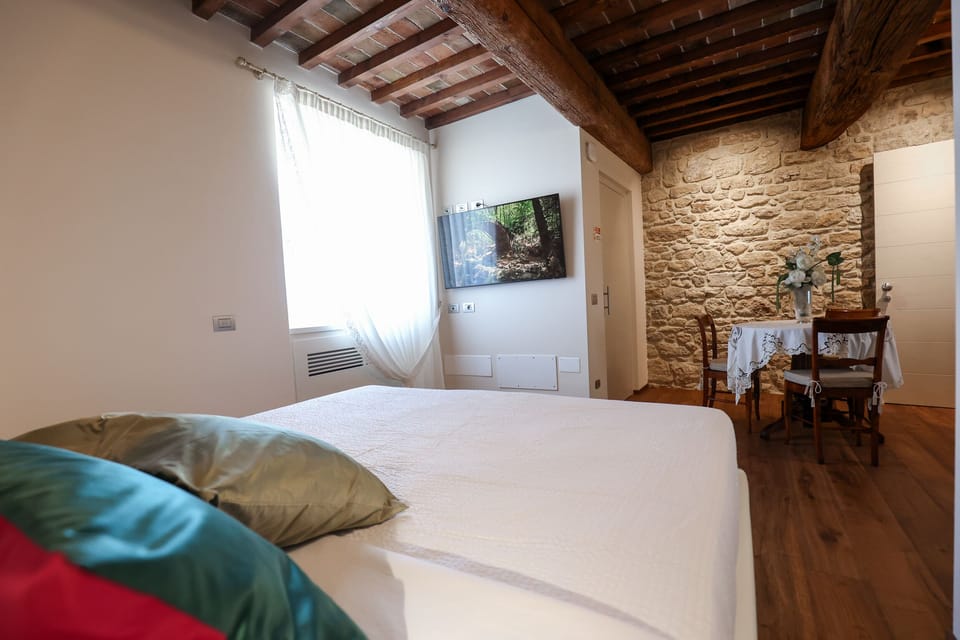 Deluxe Triple Room, Sea View | Hypo-allergenic bedding, down comforters, minibar, in-room safe