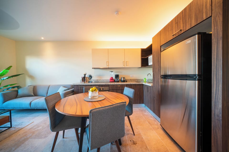 Deluxe Condo | Private kitchen | Full-size fridge, microwave, toaster, blender