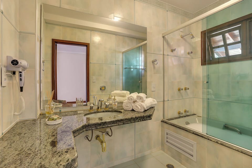 Luxury Double Room | Bathroom | Designer toiletries, hair dryer, towels, soap