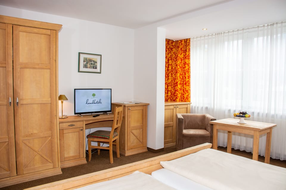 Standard Double Room | Living area | 101-cm Smart TV with cable channels, Netflix, toys