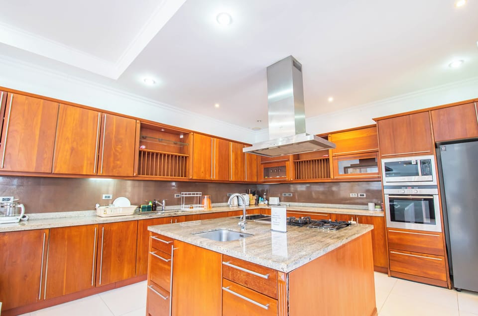 Luxury Villa | Private kitchen | Full-size fridge, microwave, oven, stovetop