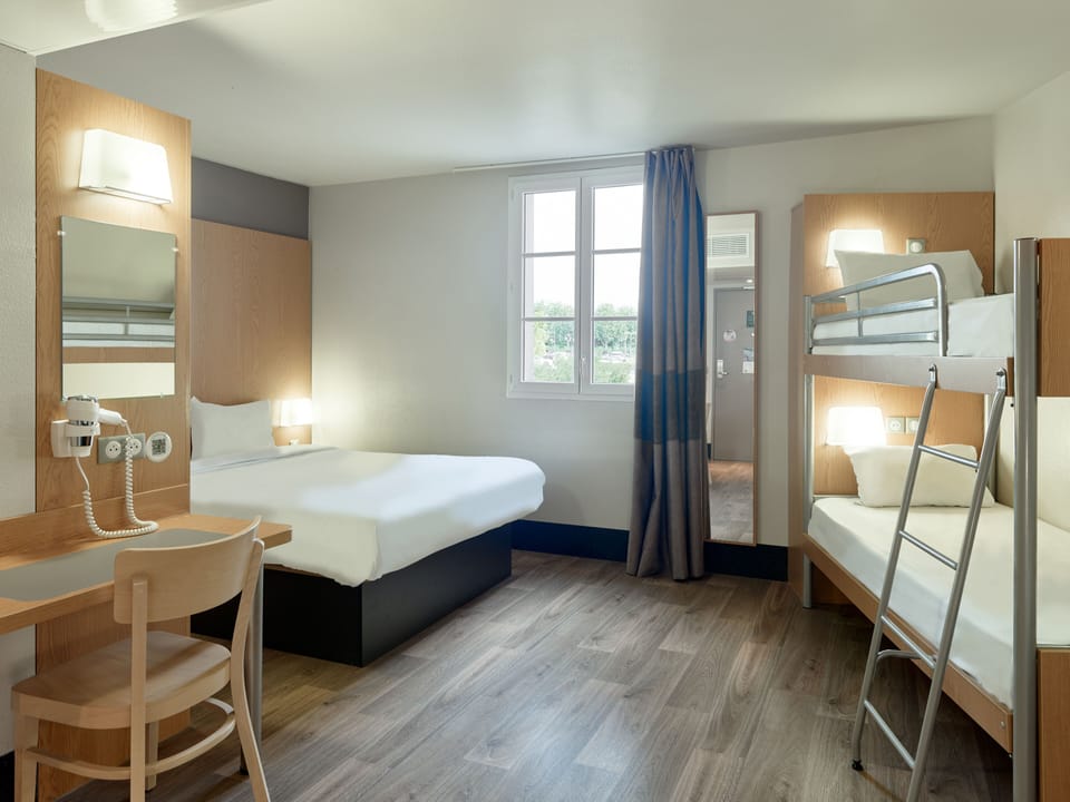 Down comforters, desk, blackout drapes, soundproofing