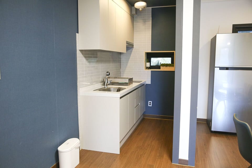 Elsa's House 1F | Private kitchen | Full-size fridge, microwave, stovetop, electric kettle