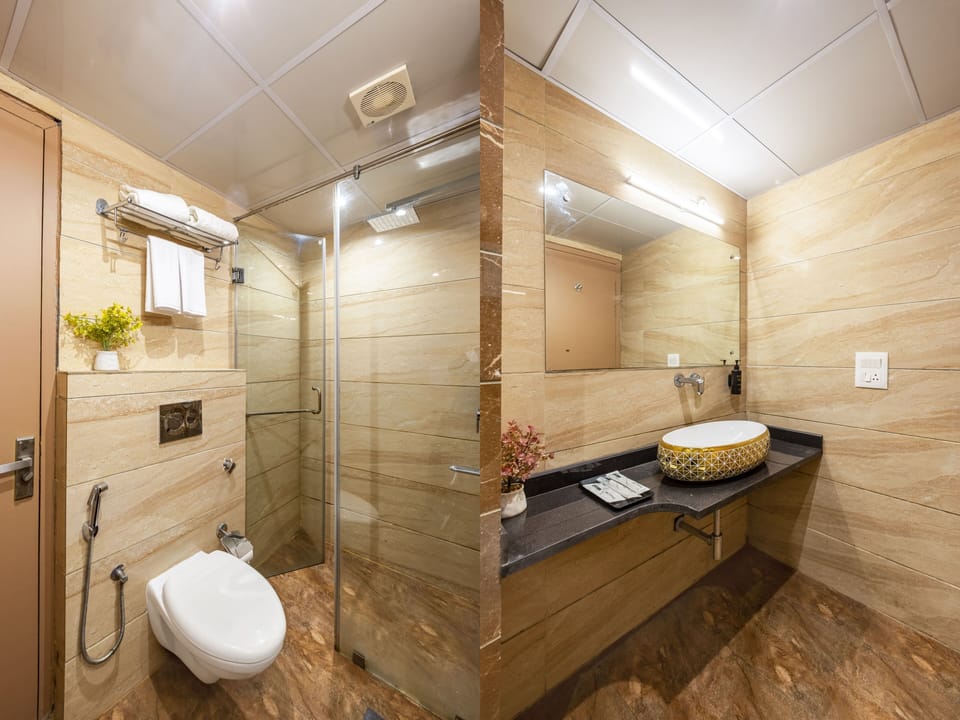 Superior Room With Balcony | Bathroom | Shower, rainfall showerhead, towels, soap
