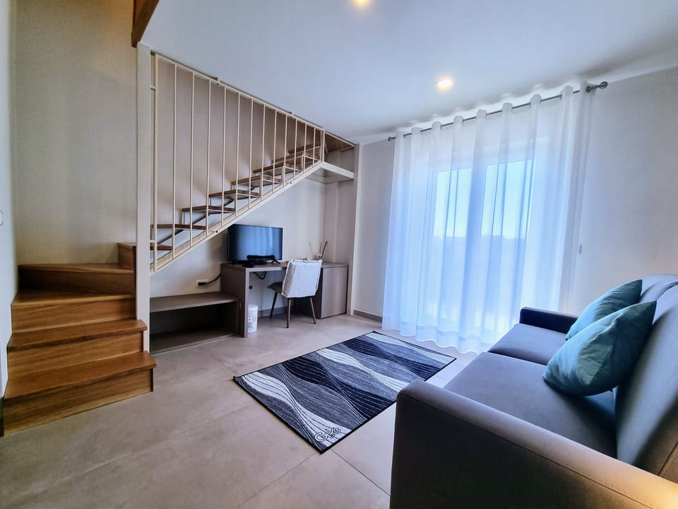 Superior Room | Living area | Flat-screen TV